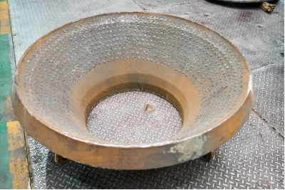High-manganese steel with embedded titanium carbide